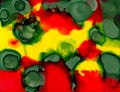 Abstract painted green spots on red yellow Royalty Free Stock Photo