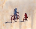 Abstract painting of bicycle rider on plain watercolor background
