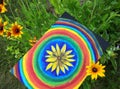 Abstract painting by oil on canvas in summer park. Yellow rudbeckia flower and rainbow circles. Royalty Free Stock Photo