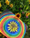 Abstract painting by oil on canvas in the summer park. Yellow rudbeckia flower and rainbow circles. Royalty Free Stock Photo