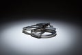 Abstract Pair of Handcuffs Under Spot Light Royalty Free Stock Photo