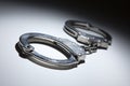 Abstract Pair of Handcuffs Under Spot Light Royalty Free Stock Photo