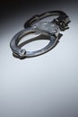 Abstract Pair of Handcuffs Under Spot Light - Text Room Royalty Free Stock Photo