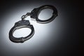 Abstract Pair of Handcuffs Under Spot Light - Text Room Royalty Free Stock Photo