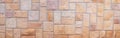 Orange grunge stone wall texture background for exterior decoration. Royalty Free Stock Photo