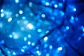 Abstract pattern of blue bokeh garland lights on a dark background Royalty Free Stock Photo