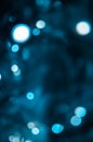 Abstract pattern of blue bokeh lights on a dark background Royalty Free Stock Photo