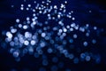 Abstract pattern of blue bokeh lights on a dark background Royalty Free Stock Photo