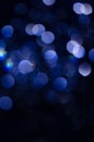 Abstract pattern of blue bokeh lights on a dark background Royalty Free Stock Photo