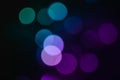 Abstract pattern of blue bokeh lights on a dark background Royalty Free Stock Photo