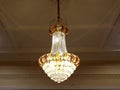 Abstract pattern light yellow gold crystal lamp in the ceiling Royalty Free Stock Photo
