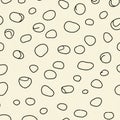 Abstract pattern featuring irregular black circles on a light beige background. The Royalty Free Stock Photo