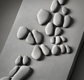 Abstract pattern of gray pebbles on board