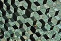 Abstract pattern made of glass wall with detail in the shapes of dark and bright hexagonal cells