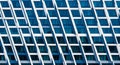 Abstract pattern of a modern building facade with repeating geometric window sections and white framing Royalty Free Stock Photo