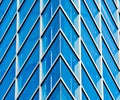 Abstract pattern of modern glass windows building with reflection from building skyscrapers of business center in the city. Royalty Free Stock Photo