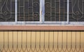 Abstract pattern of the old wrought iron balustrade with window grill on terrace of vintage house