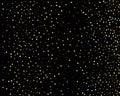 Abstract pattern of random falling gold dots on black background. Holiday abstract texture. Christmas Gold Glitter background. Royalty Free Stock Photo