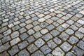 Abstract pattern of squared old-fashioned simple rough gray concrete street cobblestone pavement. Construction, decoration and ba