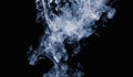 Abstract pattern of white smoke on a black background. Waves of mist and clouds. Royalty Free Stock Photo