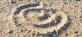 Swirl pattern on sand with footprints on Cape Cod beach. Panoramic grunge image for backgrounds.