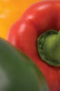 Green, red, yellow paprika pepper macro closeup, large detailed vertical background texture pattern, gentle bokeh Royalty Free Stock Photo