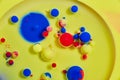 Abstract petri dish of yellow oil sphere balls of vibrant swirling colors virus bacteria background