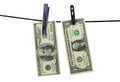 Abstract photo with american dollars with clothespins on clothesline on white background