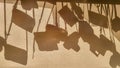 An abstract photo camera cases silhouettes on a fabric blind. Sun shining through window, making monochrome shadows of camera case Royalty Free Stock Photo