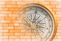 Abstract photo with compass on brick wall background