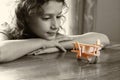 Abstract photo of cute kid looking at old wooden plane. selective focus. inspiration and childhood concept