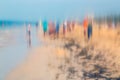 Abstract photo of people walking on the beach in the colorful impressionist style effect.