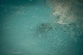 Abstract photo lifestyle, nature background. Unrecognizable person body deep under water, look at surface. Mystery mood