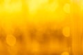 abstract photo of light gold, yellow abstract background with bokeh defocused lights. image is blurred and filtered Royalty Free Stock Photo