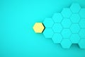 Abstract photo of ourstanding yellow beehive-like hexagons among blue hexagons on blue background. minimal business concept