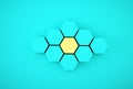 Abstract photo of ourstanding yellow beehive-like hexagons among blue hexagons on blue background. minimal business concept