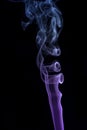 Abstract of colored blue and purple smoke with a black coloured background Royalty Free Stock Photo