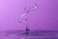 Abstract purple water drop collision