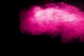 Abstract pink dust explosion on black background.abstract pink powder splattered on black background Royalty Free Stock Photo