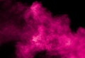 Abstract pink dust particles explosion on black background.Freeze motion of pink powder splash Royalty Free Stock Photo