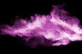 Abstract pink dust particles explosion on black background.Freeze motion of pink powder splash Royalty Free Stock Photo