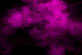 Abstract pink dust particles explosion on black background.Freeze motion of pink powder splash Royalty Free Stock Photo