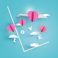 Abstract pink heart hot air balloons carrying LOVE letter in pale blue sky with white clouds