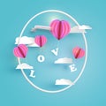 Abstract pink heart hot air balloons carrying LOVE letter in pale blue sky with white clouds Royalty Free Stock Photo