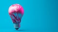 Abstract Pink Light Bulb Wrapped in Glossy Fabric Floating Against a Blue Background. Generative AI Royalty Free Stock Photo