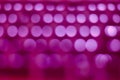 Abstract pink magenta bokeh background with soft focus lights in rows Royalty Free Stock Photo