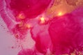Abstract pink, magenta and gold fluid art alcohol ink pattern with marble texture