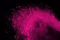 Freeze motion of colored powder explosion isolated on black background. Abstract of Multicolor dust splatted. Royalty Free Stock Photo