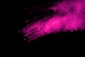 Abstract pink powder splatted background,Freeze motion of color powder exploding/throwing color powder,color glitter texture on bl Royalty Free Stock Photo