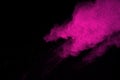 Abstract pink powder splatted background,Freeze motion of color powder exploding/throwing color powder,color glitter texture on bl Royalty Free Stock Photo